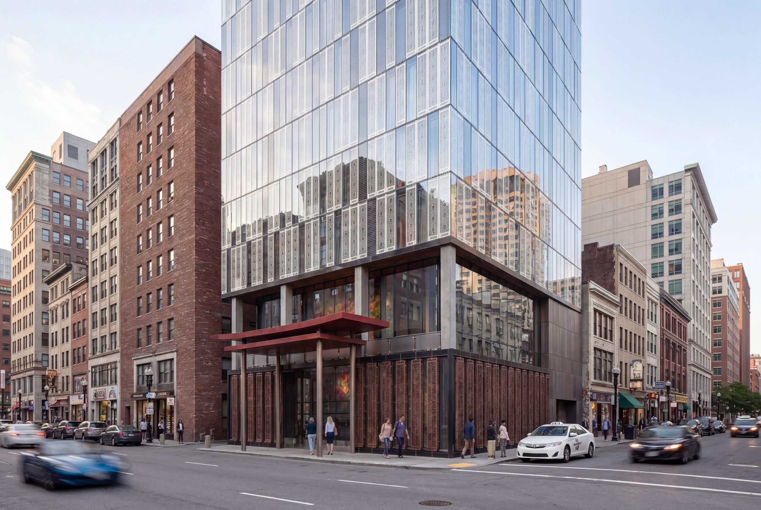 Contemporary conceptual hotel tower in Boston’s Chinatown featuring a sleek reflective glass façade, patterned metal screening, and a vibrant street-level arrival canopy designed to activate the surrounding urban streetscape. The design blends modern hospitality architecture with subtle cultural detailing to create a refined new landmark within downtown Boston.<br />
