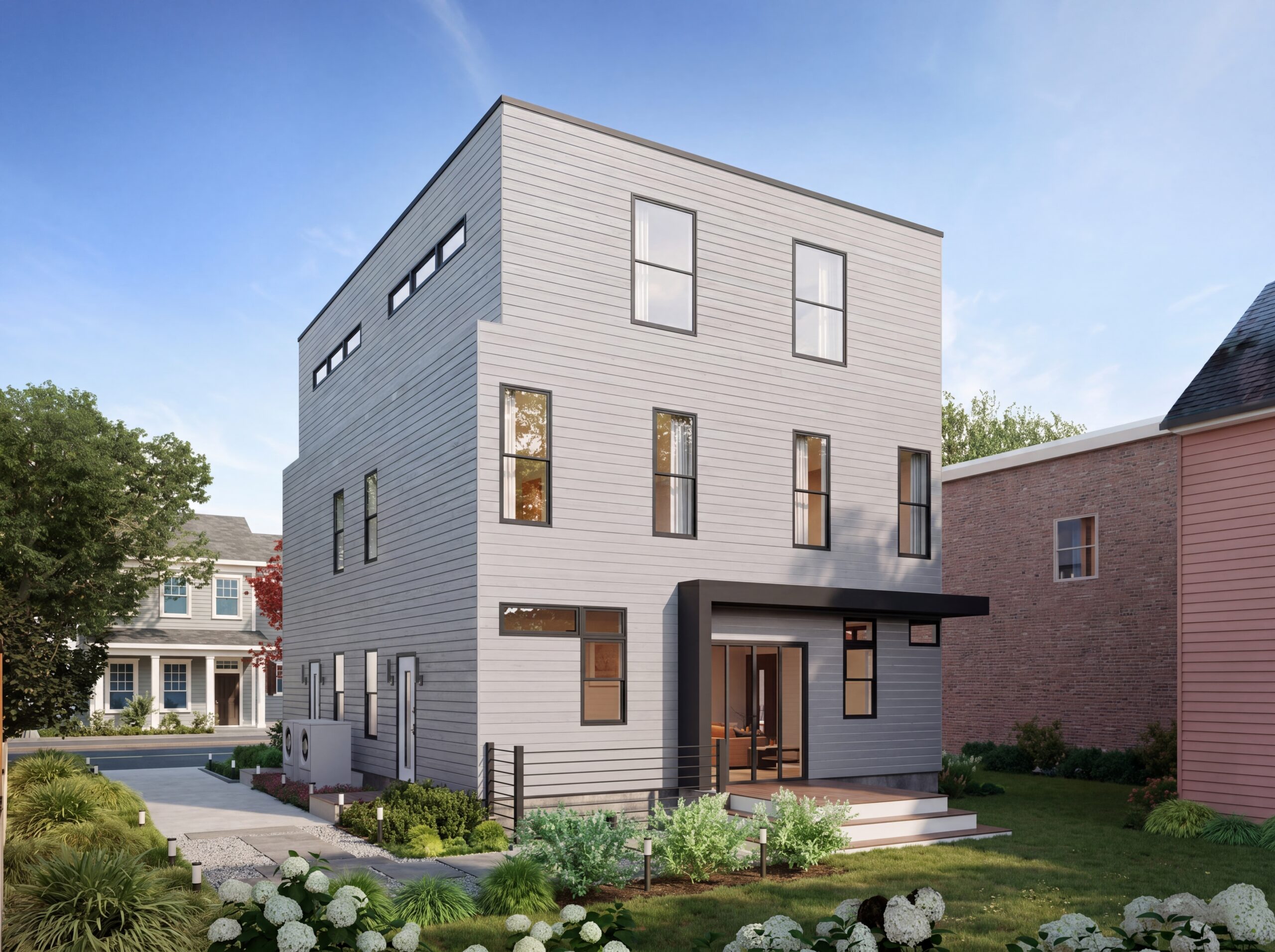 Modern Cambridge multifamily residence with minimalist architecture, contemporary white siding, black metal canopy, and landscaped urban infill design.<br />
