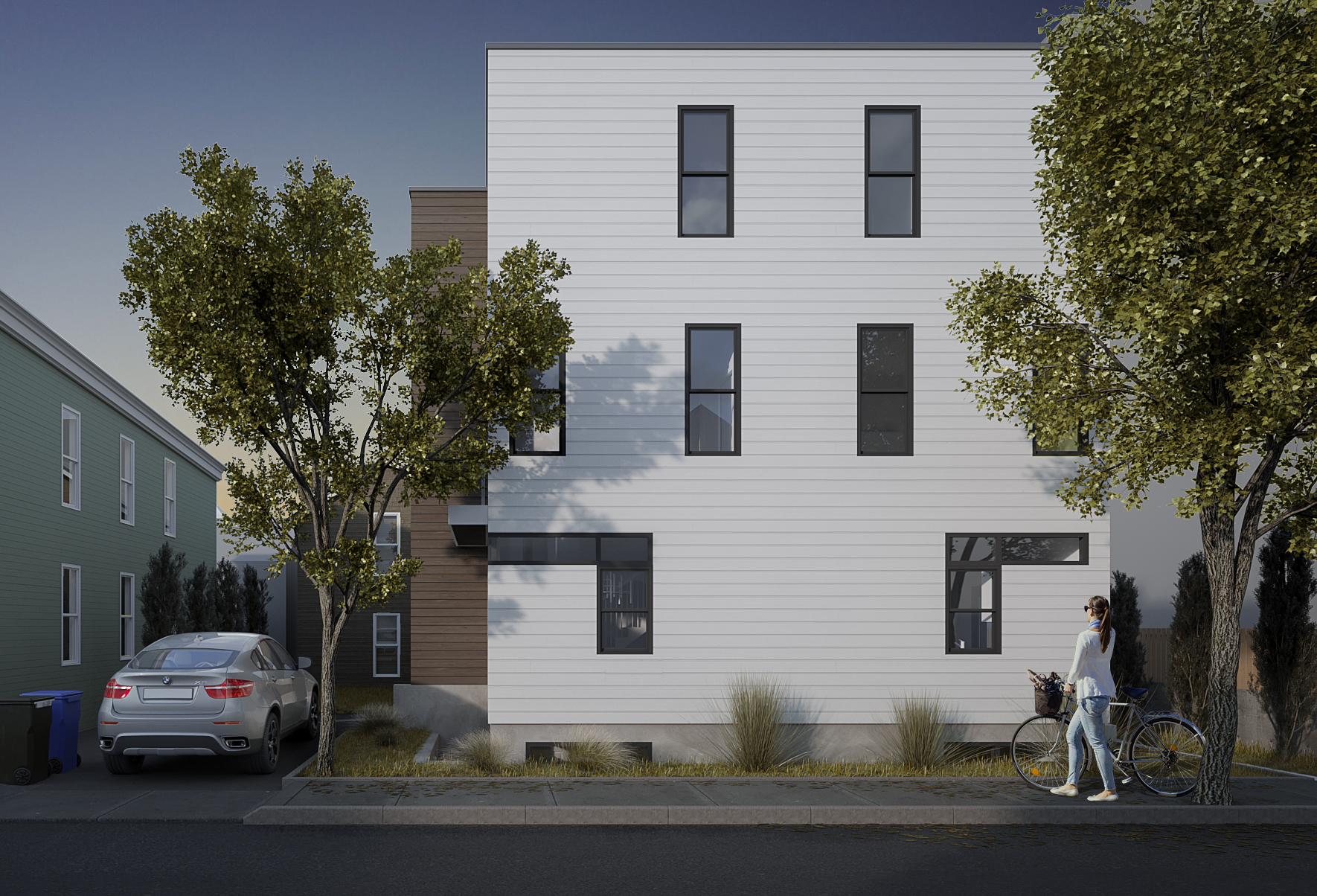 Street-facing elevation of a modern Cambridge multifamily development with minimalist white facade, contemporary windows, and urban infill architecture.<br />
