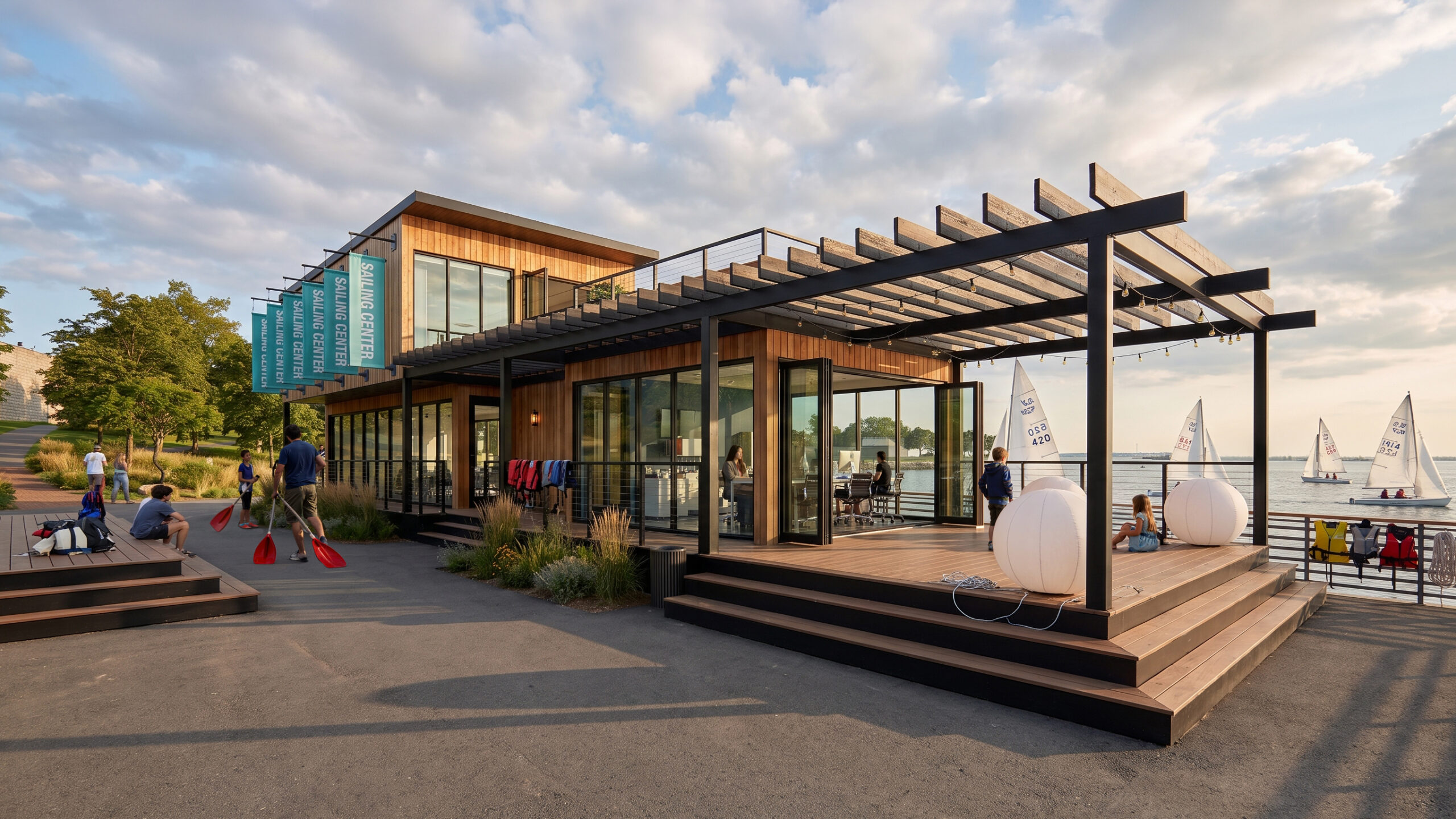 Architectural rendering of a wood-clad waterfront sailing center with a pergola-covered deck, open glass doors, and children carrying paddles beside sailboats on the water.