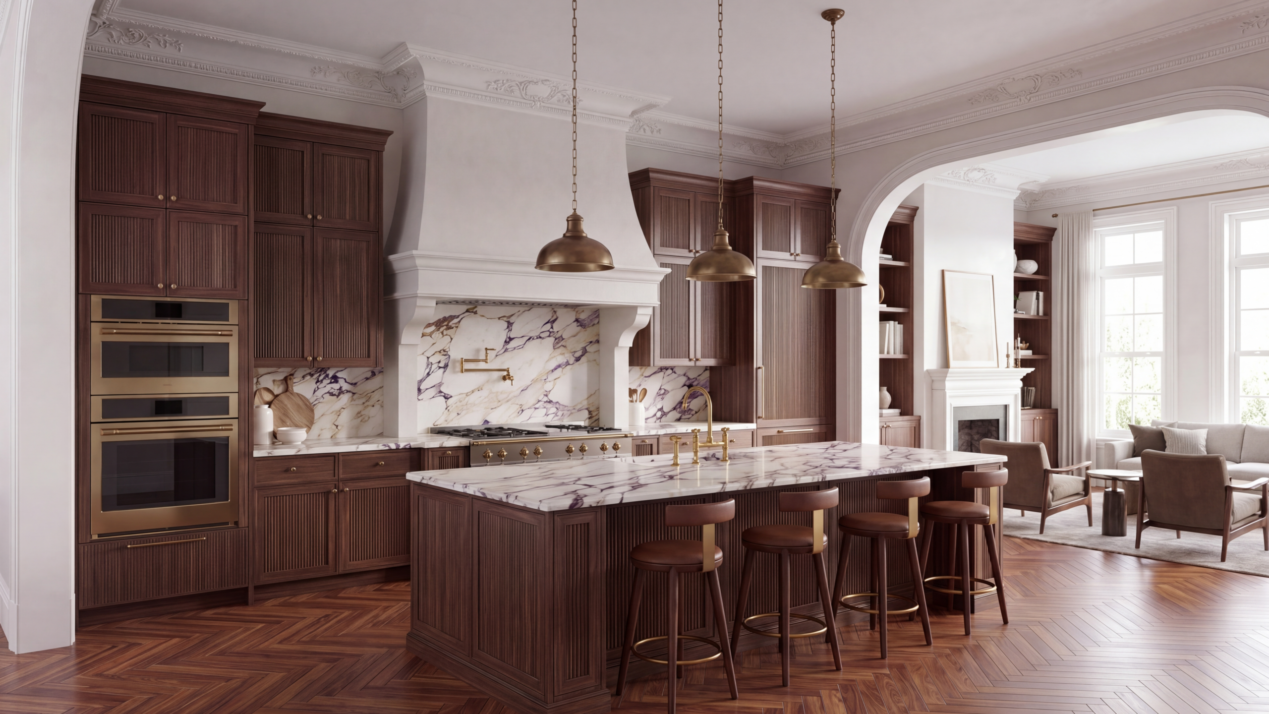 Kitchen with dark fluted wood cabinetry, purple-veined marble countertops and backsplash, and a large island with four leather stools beneath brass pendant lights. Ornate crown molding and herringbone wood floors extend into an adjoining sunlit sitting room with a fireplace.